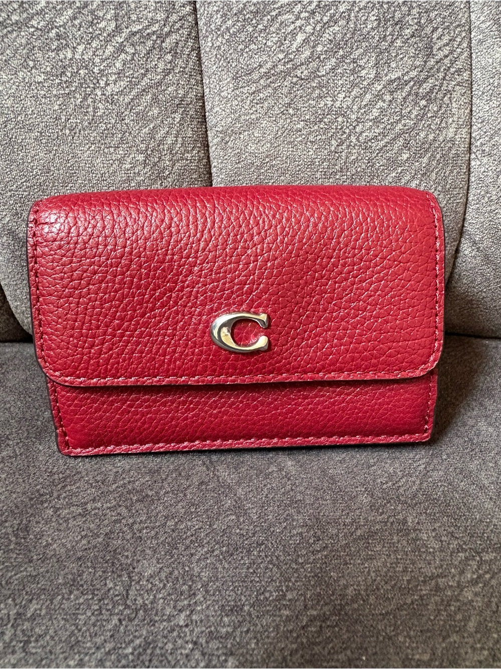 Coach Essential Mini Tri Wallet Pebbled in Dark Ruby with Silver 'C' Accent